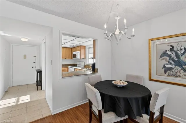 a view of a dining room with furniture and window