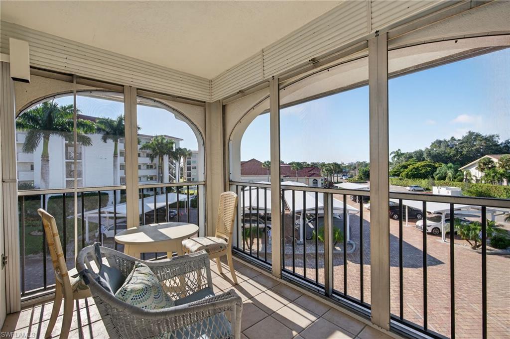 5 High Point Circle West, Unit 303 Naples, FL 34103 - Photo 28 of 36 a view of balcony with furniture