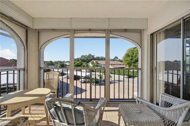 a view of balcony with furniture