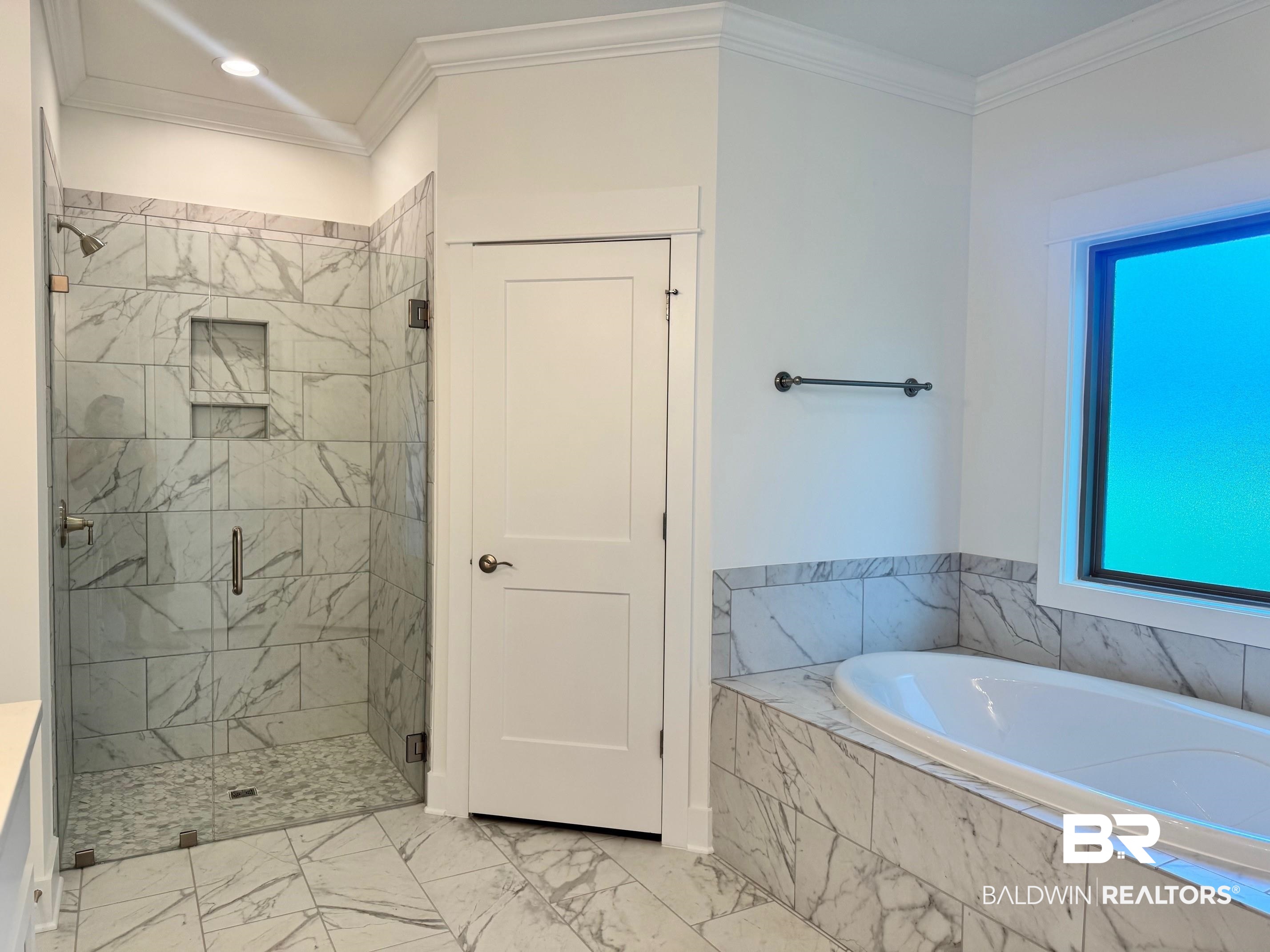 12248 Exbury Way Daphne, AL 36527 - Photo 6 of 63 Full bathroom featuring a marble finish shower, ornamental molding, a bath, light marble finish flooring, and recessed lighting