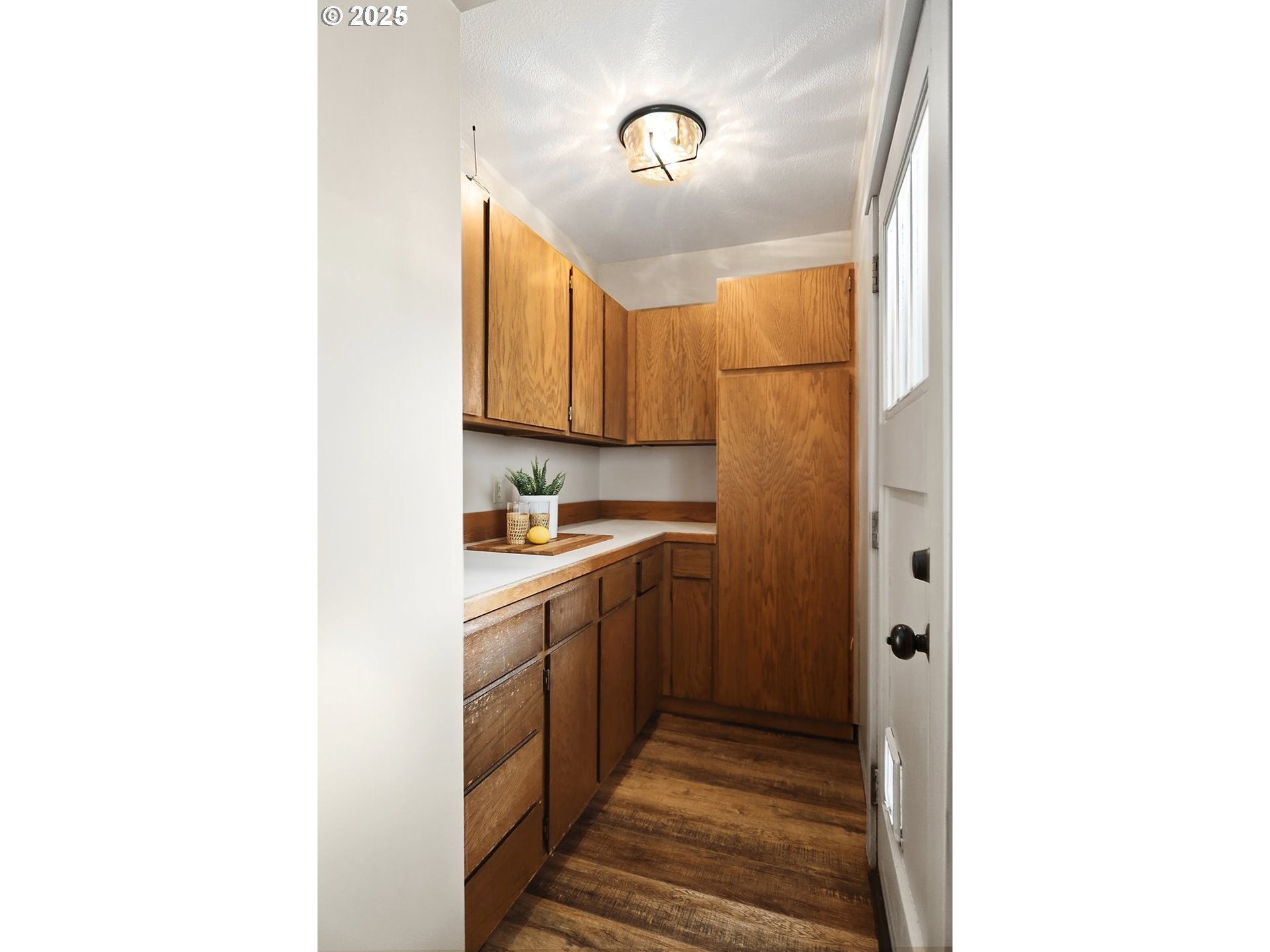 1014 Laughlin Street The Dalles, OR 97058 - Photo 11 of 36 a kitchen with a sink cabinets and stainless steel appliances