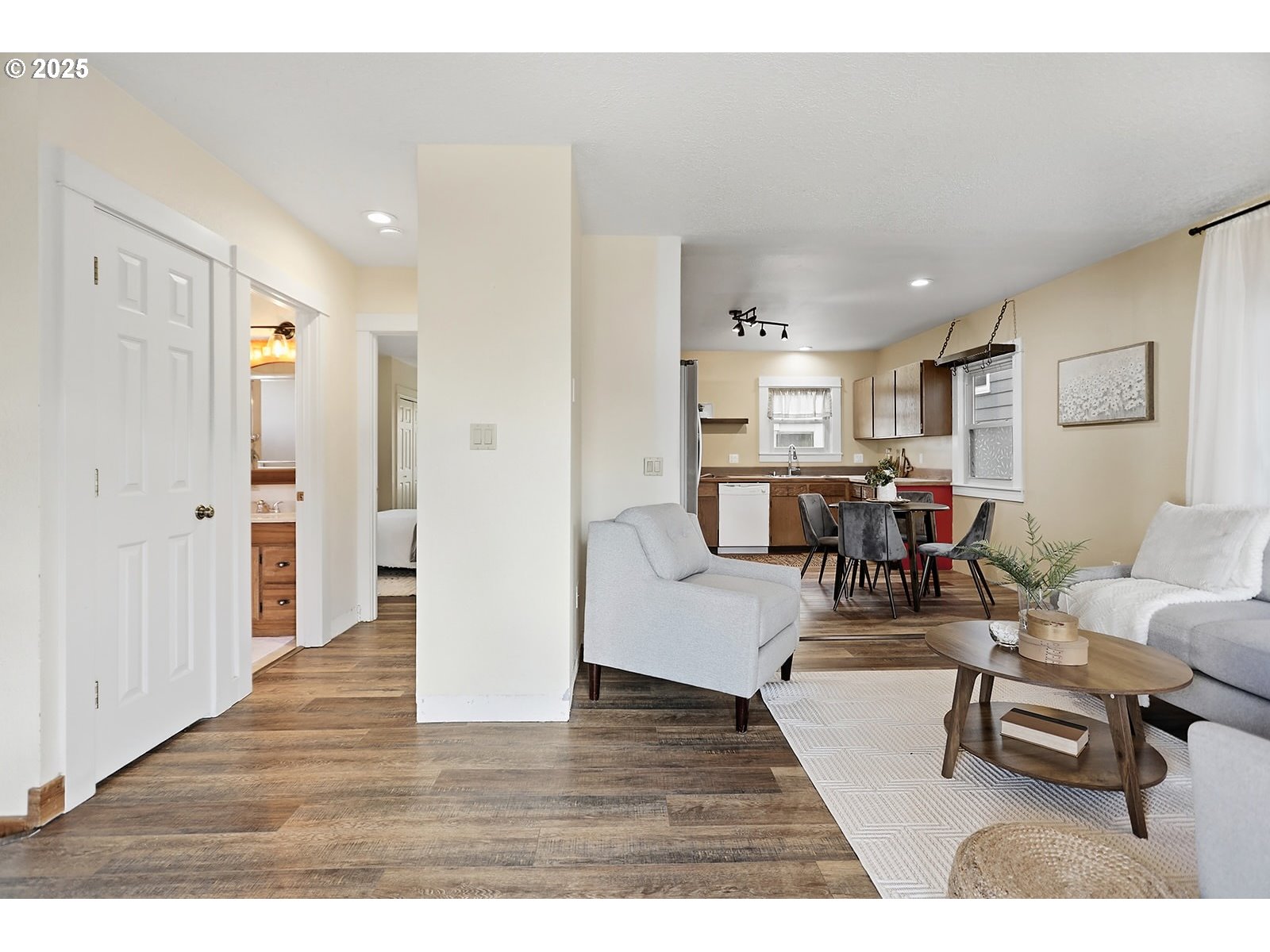 1014 Laughlin Street The Dalles, OR 97058 - Photo 13 of 36 a living room with furniture and a wooden floor
