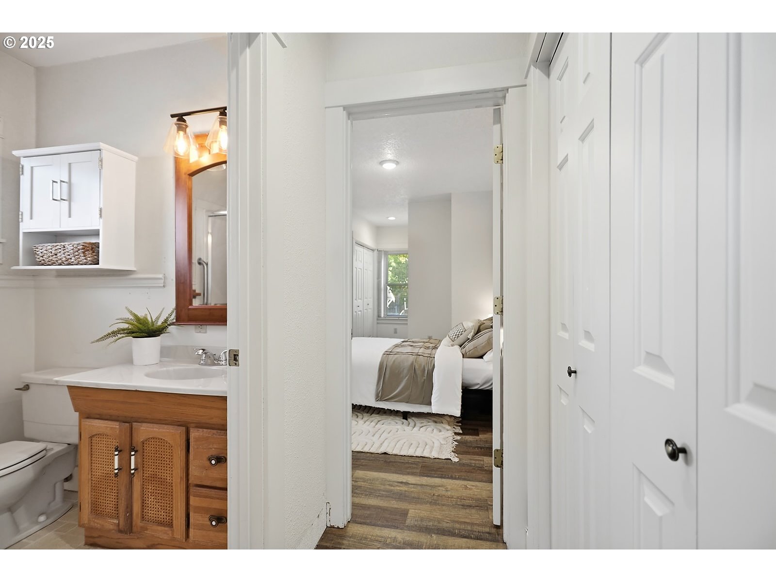 1014 Laughlin Street The Dalles, OR 97058 - Photo 14 of 36 a en suite bathroom with a granite countertop sink and a mirror
