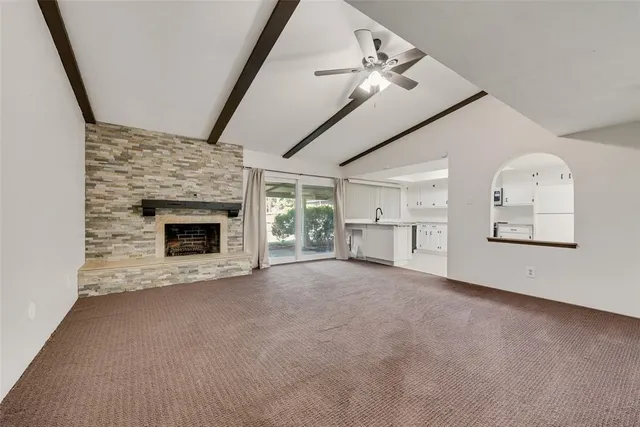 a view of empty room with fireplace