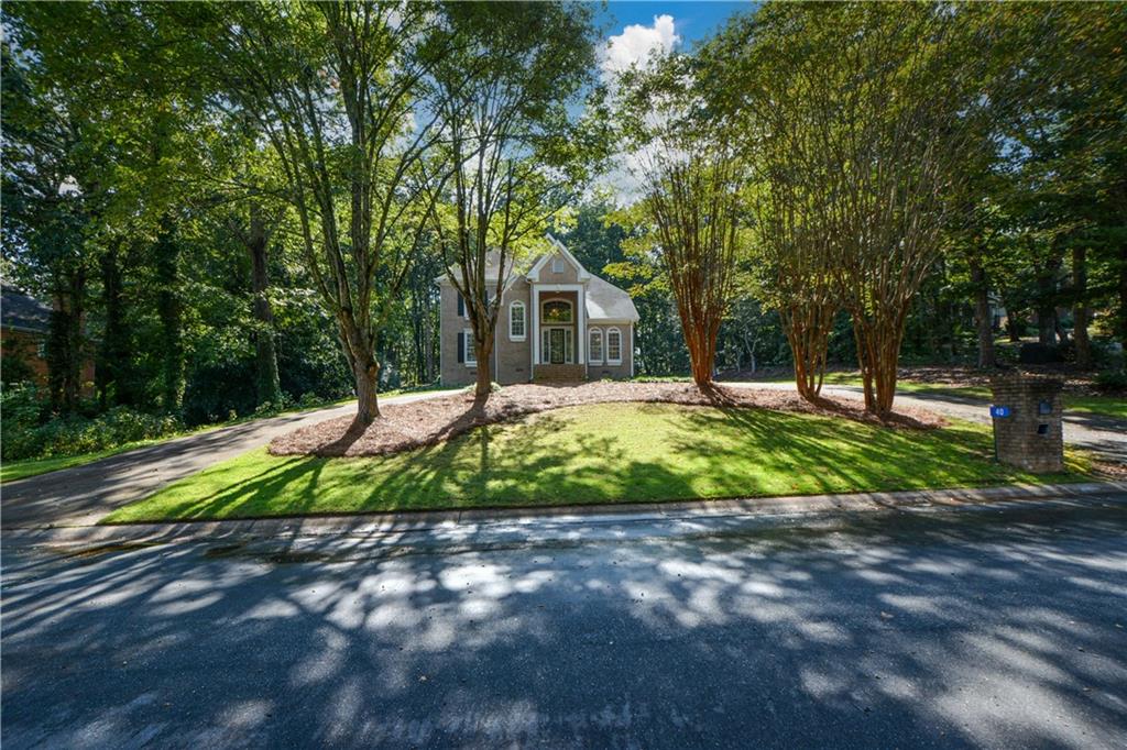 a view of a house with a yard