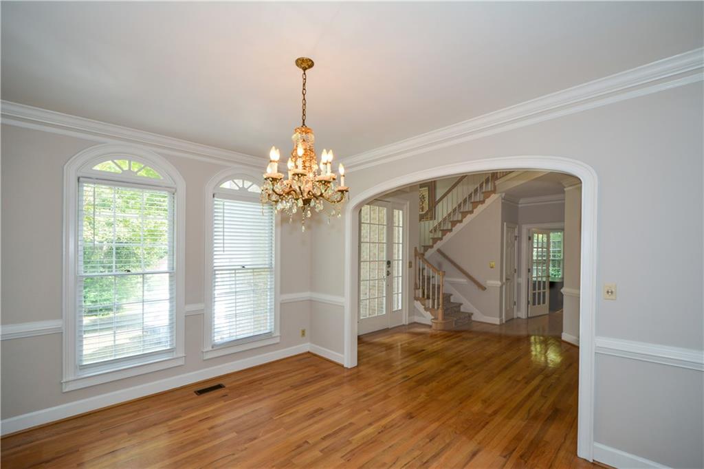 40 Waverly Lane Winder, GA 30680 - Photo 12 of 40 a view of a room with wooden floor staircase and a chandelier