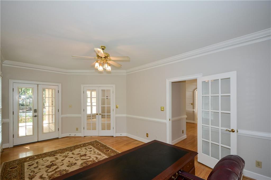 40 Waverly Lane Winder, GA 30680 - Photo 14 of 40 a view of a livingroom with wooden floor and a ceiling fan