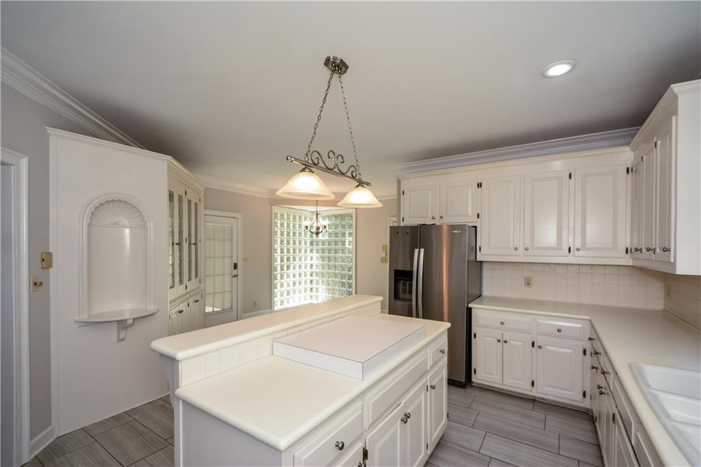 40 Waverly Lane Winder, GA 30680 - Photo 16 of 40 a kitchen with stainless steel appliances a refrigerator sink and cabinets