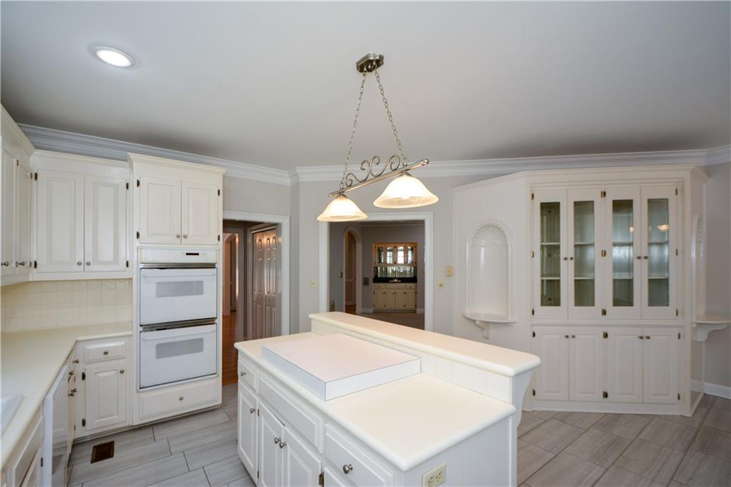 40 Waverly Lane Winder, GA 30680 - Photo 17 of 40 a kitchen with white cabinets and window