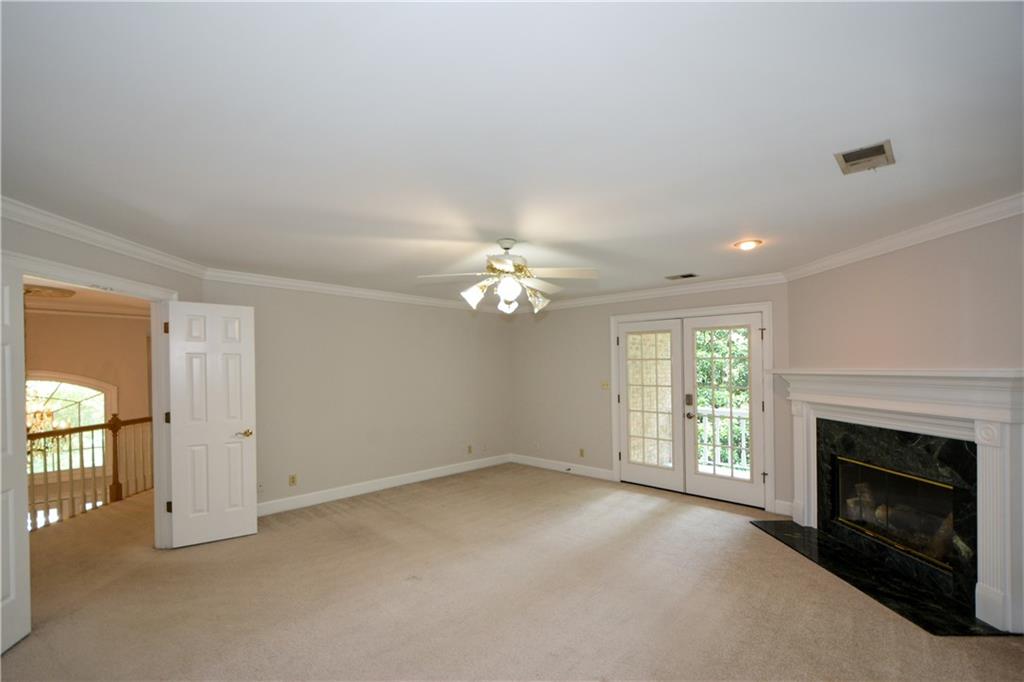 40 Waverly Lane Winder, GA 30680 - Photo 26 of 40 an empty room with windows and fireplace