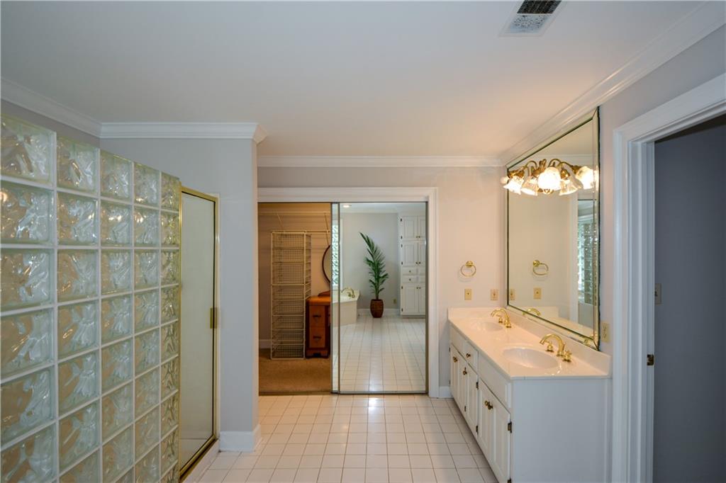 40 Waverly Lane Winder, GA 30680 - Photo 27 of 40 a bathroom with a double vanity sink and mirror