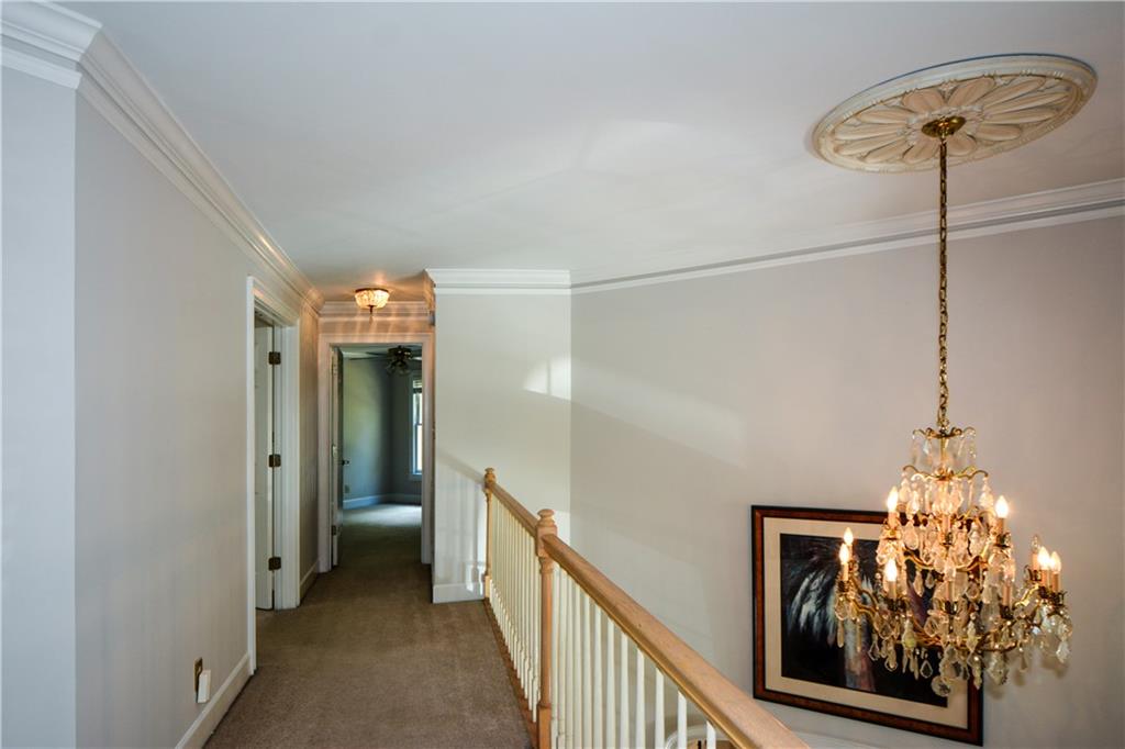 40 Waverly Lane Winder, GA 30680 - Photo 32 of 40 a view of a hallway to a room with wooden floor and staircase