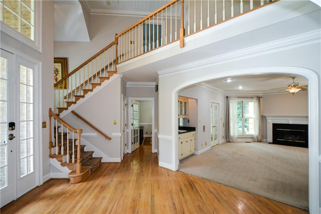 40 Waverly Lane Winder, GA 30680 - Photo 7 of 40 a view of a hallway with wooden floor fireplace and windows
