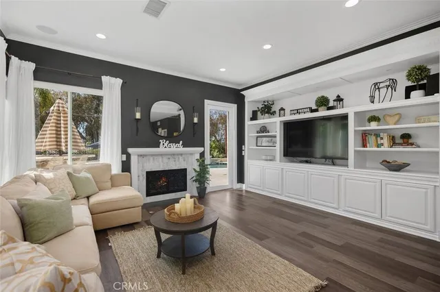 a living room with furniture a rug and a table