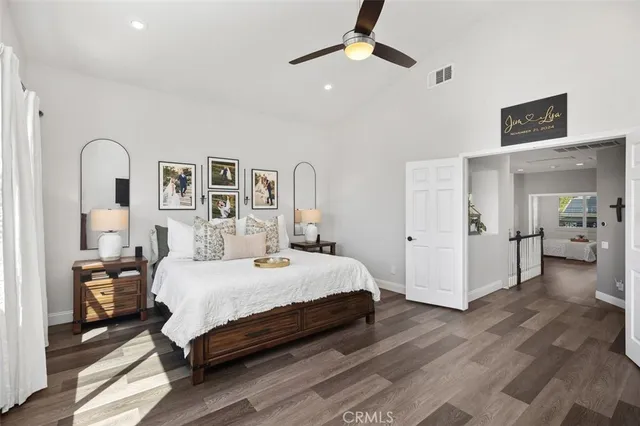 a bedroom with a large bed and a window