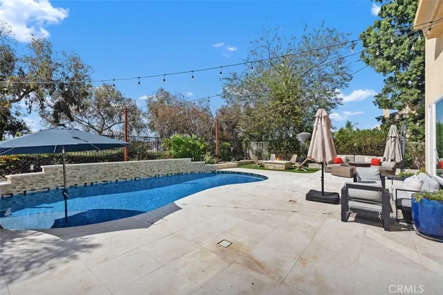 an aerial view of a house with a garden and plants