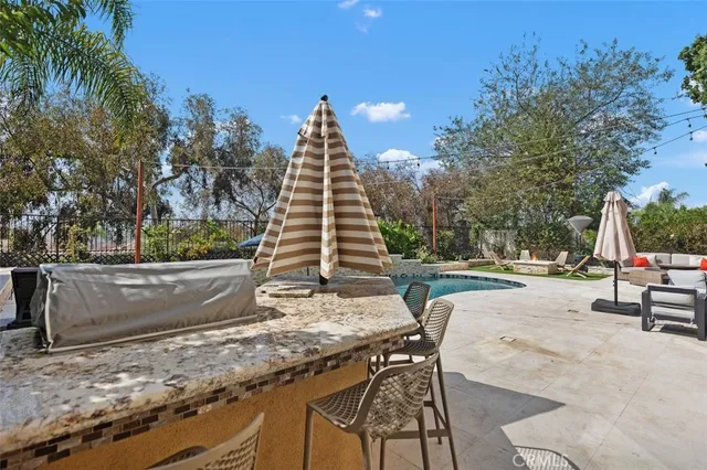 an aerial view of a house with garden space and street view