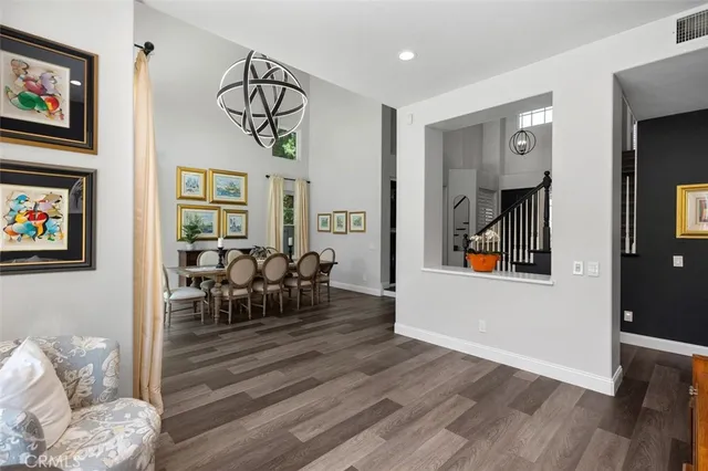 a kitchen with kitchen island a stove a table and chairs