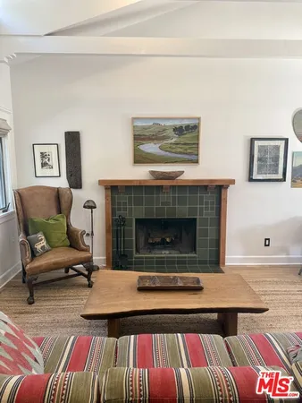 a living room with a couch and a fireplace