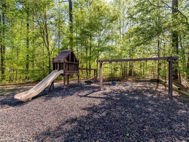 a backyard of a house with lots of green space