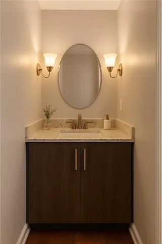 a bathroom with a sink vanity and a mirror