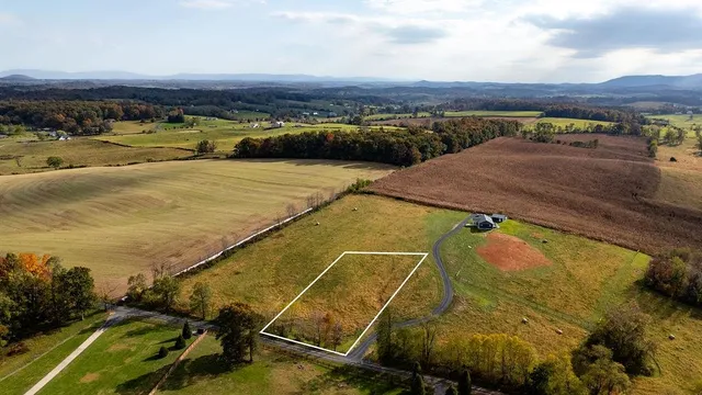 a view of a swimming pool with a lake view and mountain view