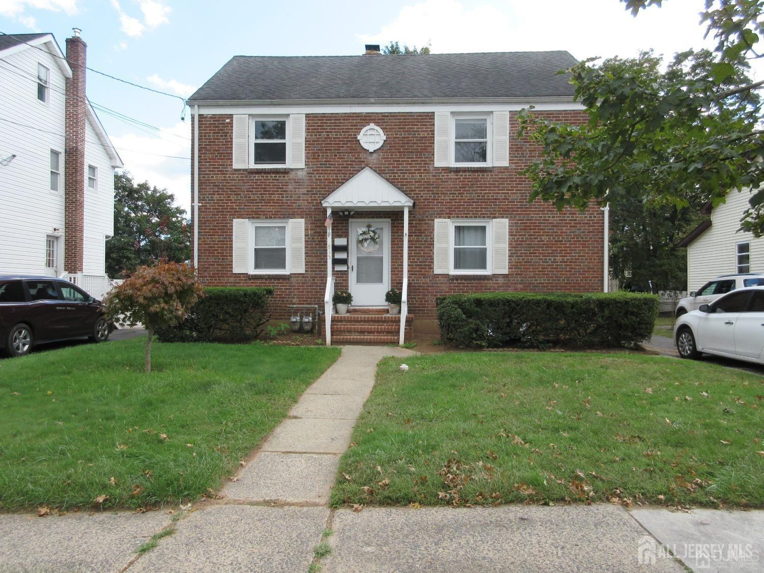 815 2nd Street, Unit B Dunellen, NJ 08812 - Photo 2 of 13 a front view of a house with a yard