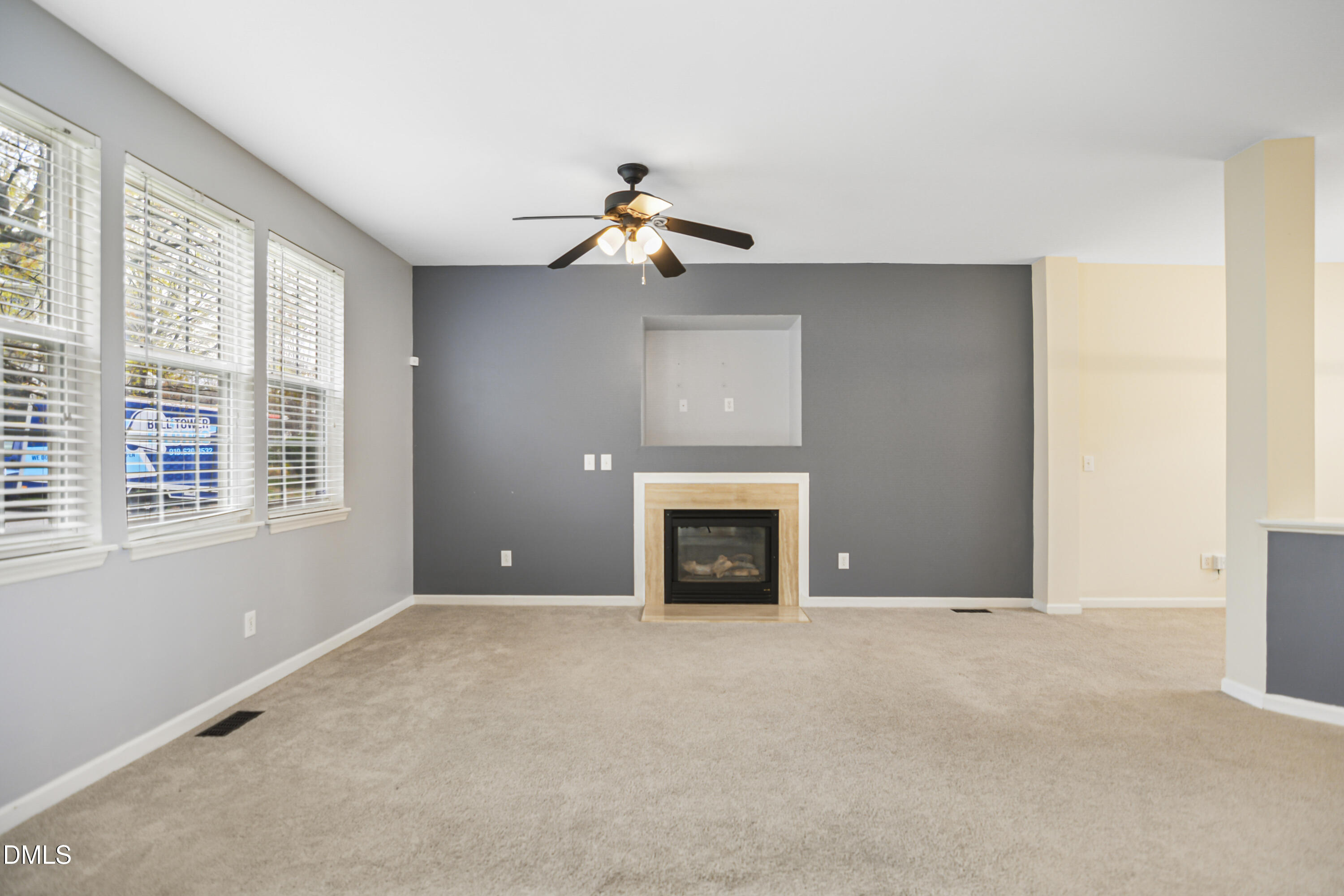 2241 Spruce Shadows Lane Raleigh, NC 27614 - Photo 8 of 29 a view of a livingroom with a fireplace and window