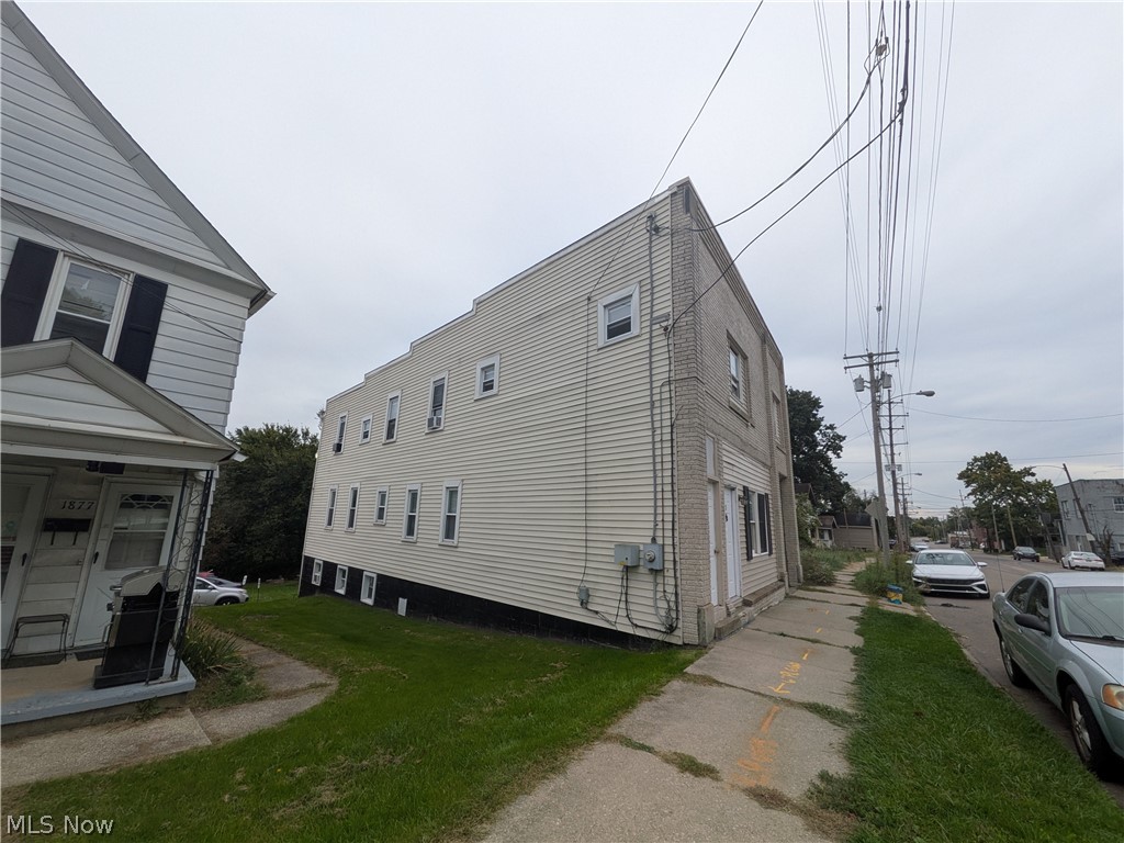 1881 Manchester Road, Unit 1 Akron, OH 44314 - Photo 43 of 44 1881 Manchester Rd, Akron, OH 44314 Unit #1 ground floor access and living. Welcome to this spacious 2-bedroom, 1-bathroom first-floor generous and remodeled apartment in the Kenmore neighborhood of Akron, offering a great amount of comfortable living space. This move-in ready apartment features LVP flooring throughout, a spacious living room, room for dining, separate kitchen with a gas range and stainless steel refrigerator, two bedrooms, and a full private bathroom which has a convenient step-in shower. Large windows provide natural light, while ample closets offer plenty of storage. Enjoy off-street parking and a backyard with a picnic table and small firepit, providing a pleasant outdoor space to relax and enjoy for the buildings tenants.