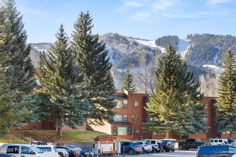 a city street lined with buildings and cars