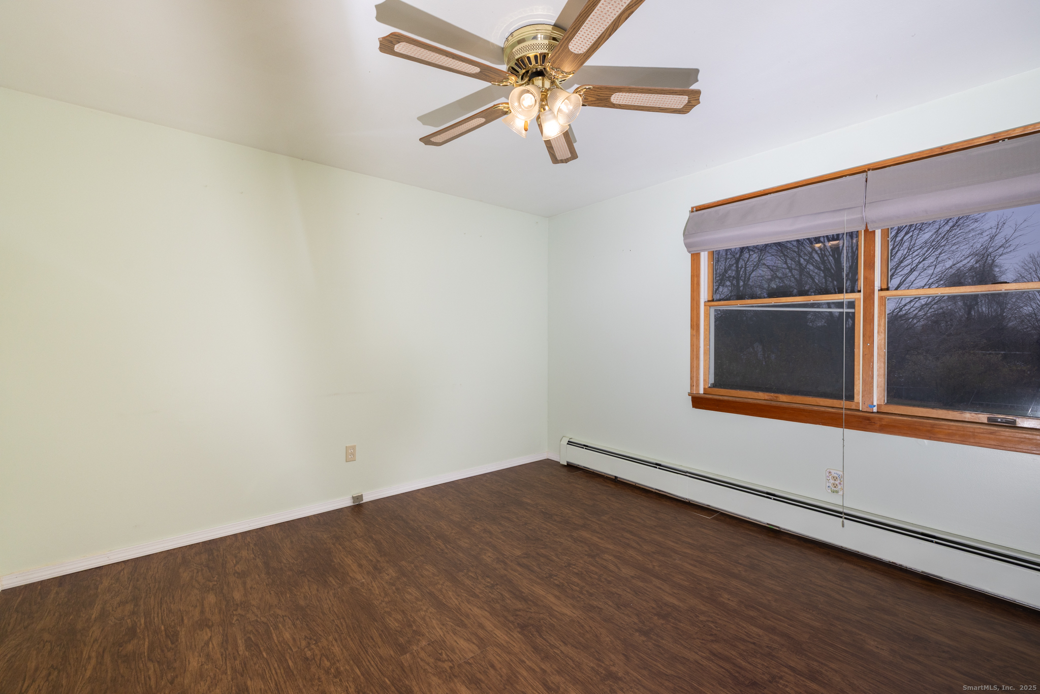 93 Tawny Thrush Road Naugatuck, CT 06770 - Photo 12 of 33 an empty room with a window and a ceiling fan