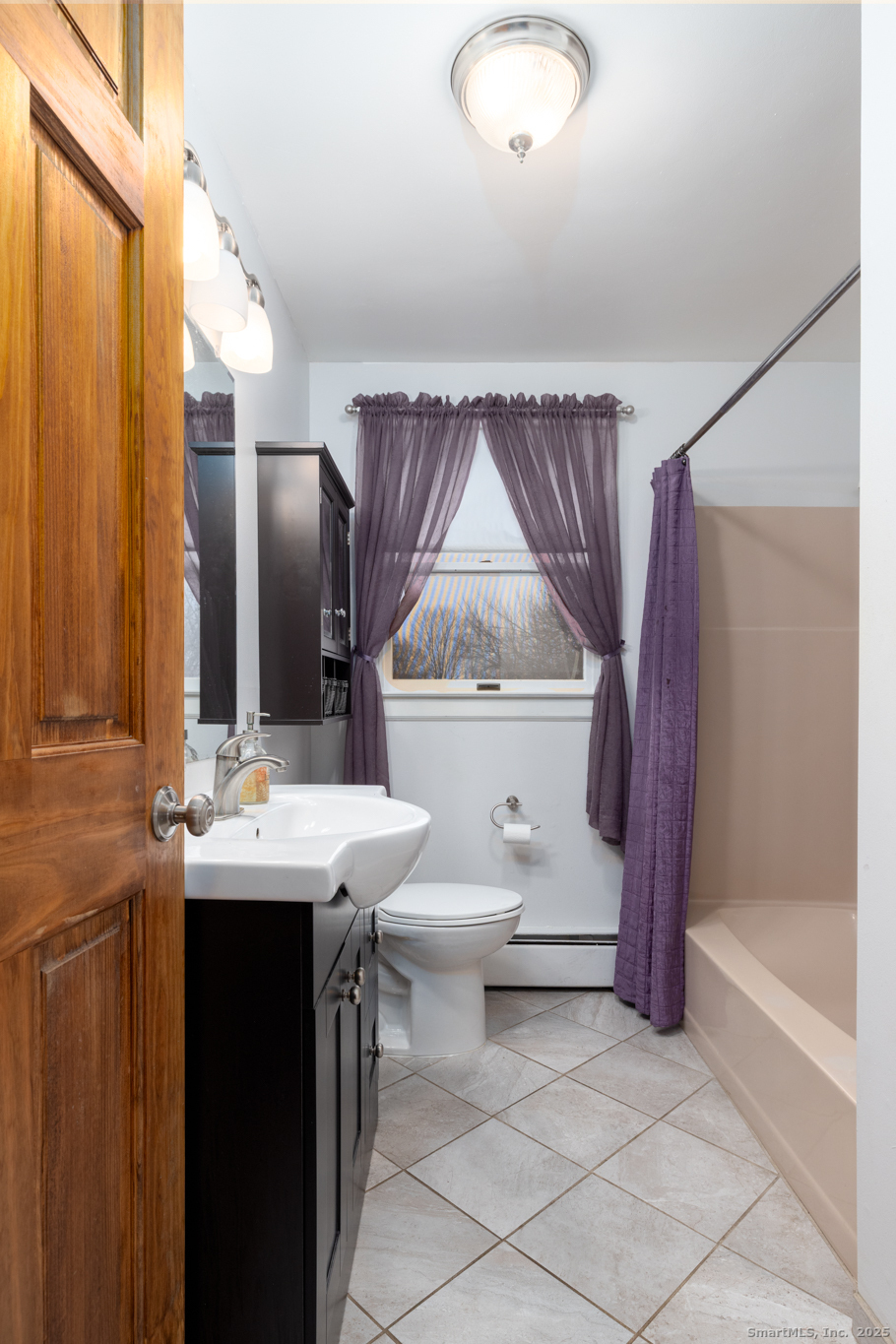 93 Tawny Thrush Road Naugatuck, CT 06770 - Photo 14 of 33 a bathroom with a sink a toilet and shower