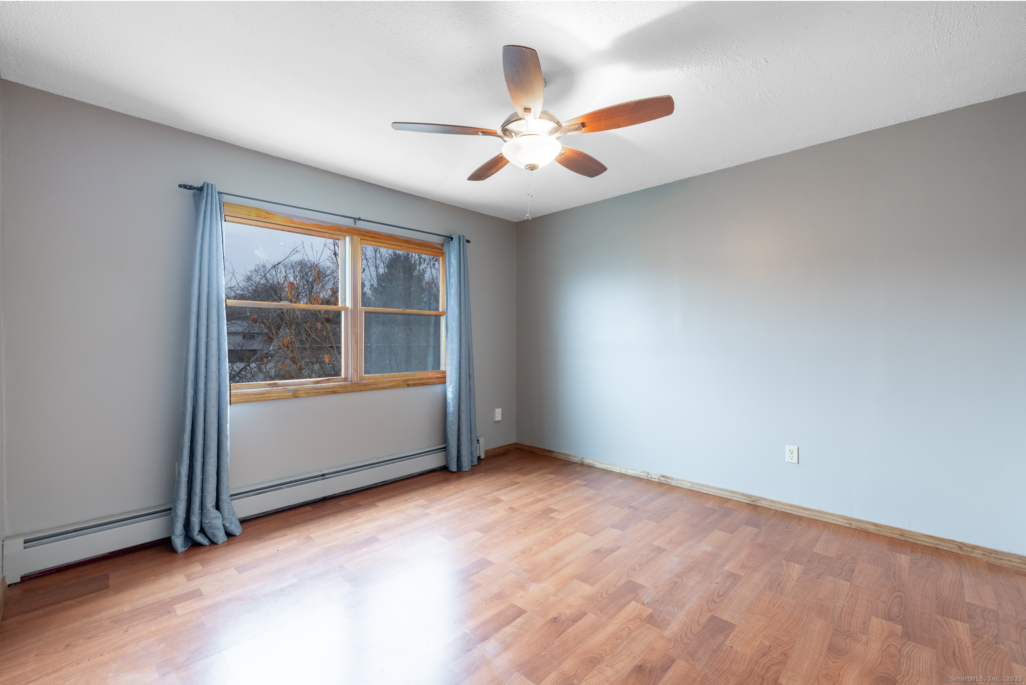 93 Tawny Thrush Road Naugatuck, CT 06770 - Photo 21 of 33 an empty room with window and ceiling fan