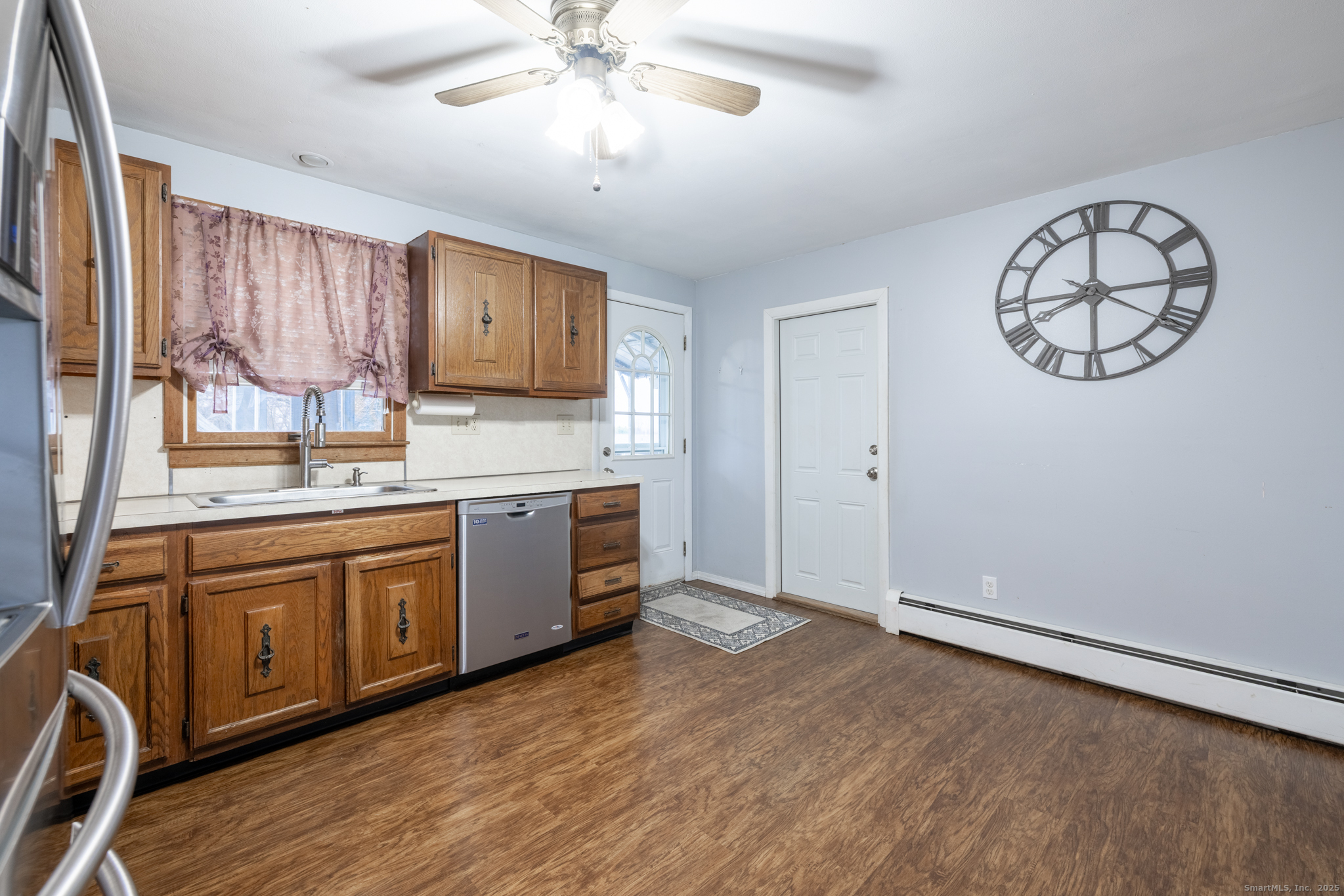93 Tawny Thrush Road Naugatuck, CT 06770 - Photo 5 of 33 a large kitchen with stainless steel appliances granite countertop a stove a sink dishwasher and a refrigerator with wooden floor