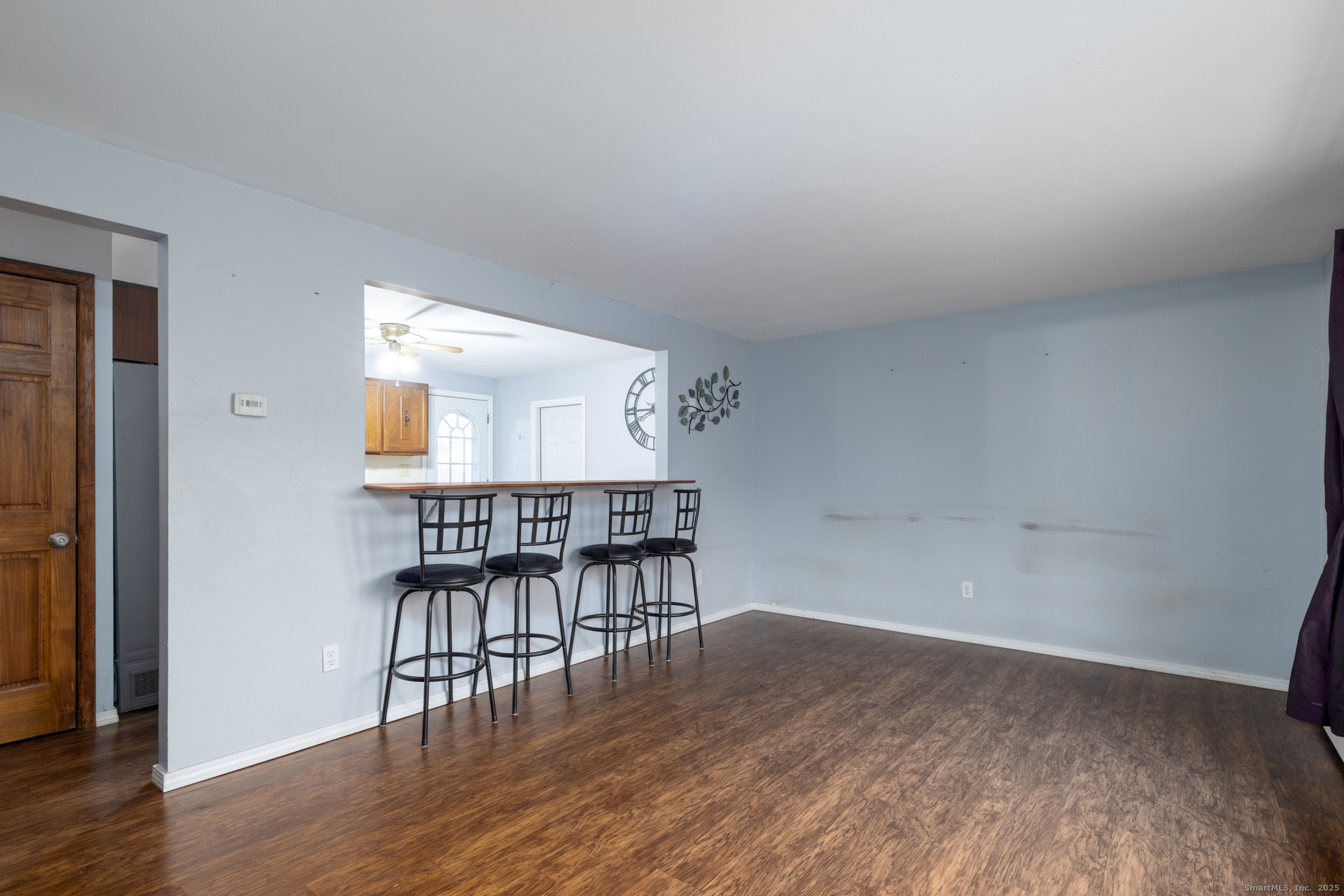 93 Tawny Thrush Road Naugatuck, CT 06770 - Photo 8 of 33 a workspace room with wooden floor table and chairs