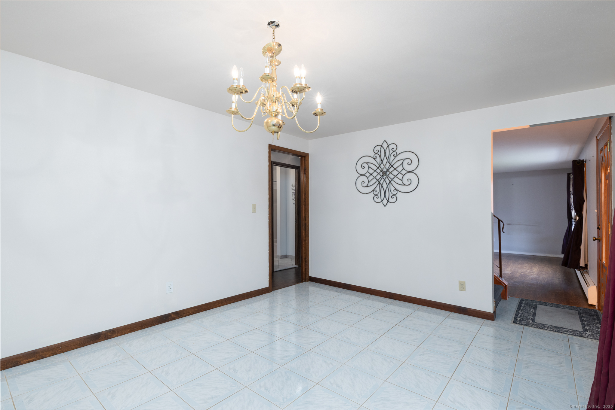 93 Tawny Thrush Road Naugatuck, CT 06770 - Photo 9 of 33 a view of a livingroom with a chandelier