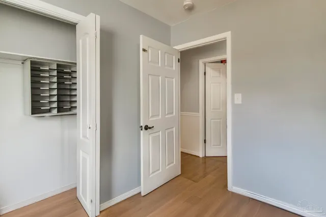 wooden floor with white walls