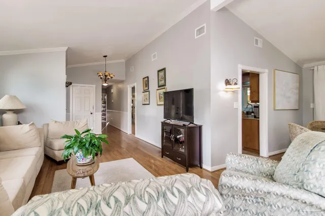 a bedroom with a bed and a television