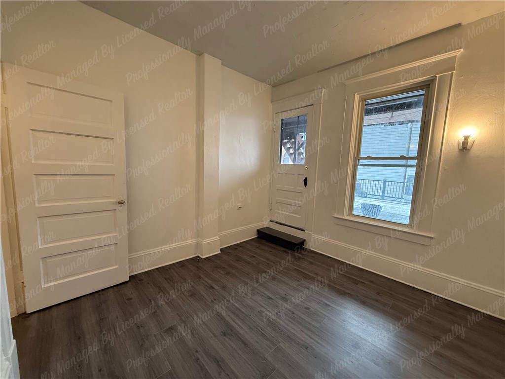 44 West High Street, Unit B Springfield, OH 45502 - Photo 27 of 31 This bright space features sleek flooring and ample natural light, creating an inviting atmosphere.