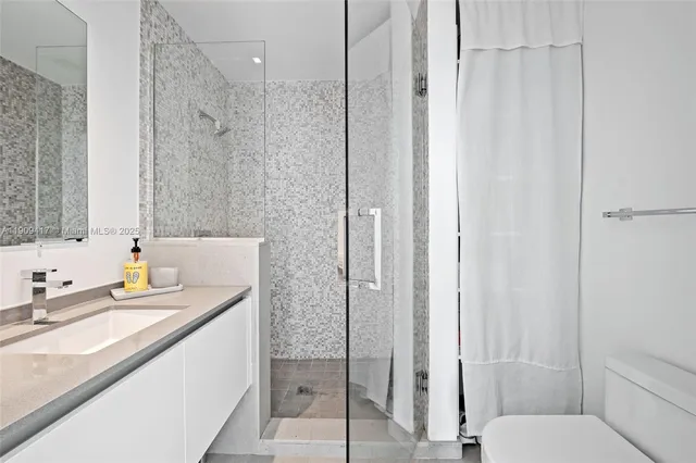 a view of front door with wooden floor