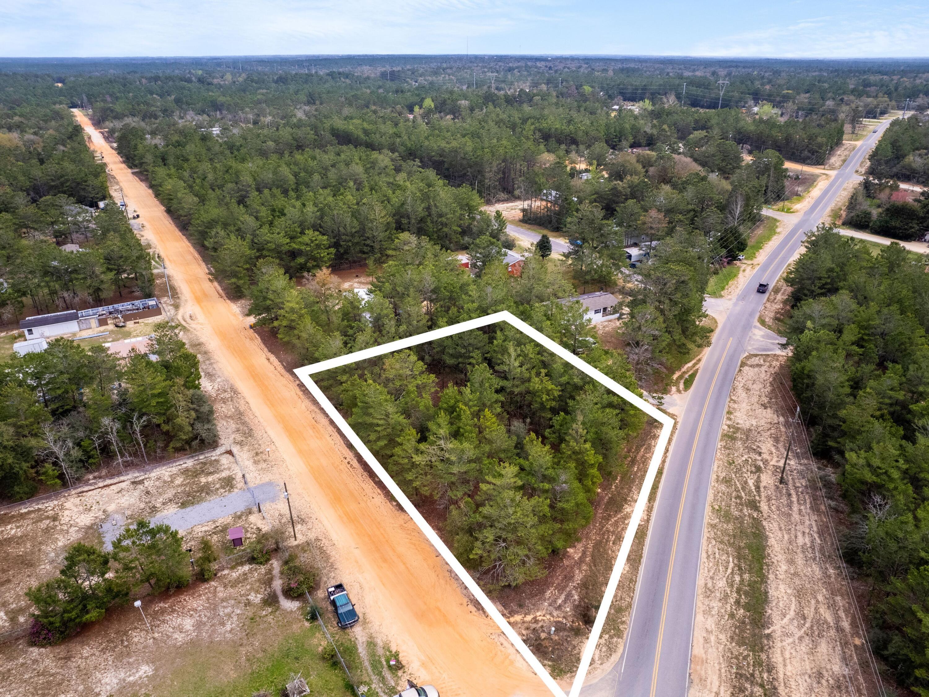 1-2 Girl Scout Road DeFuniak Springs, FL 32433 - Photo 1 of 13 a view of a lake from a balcony