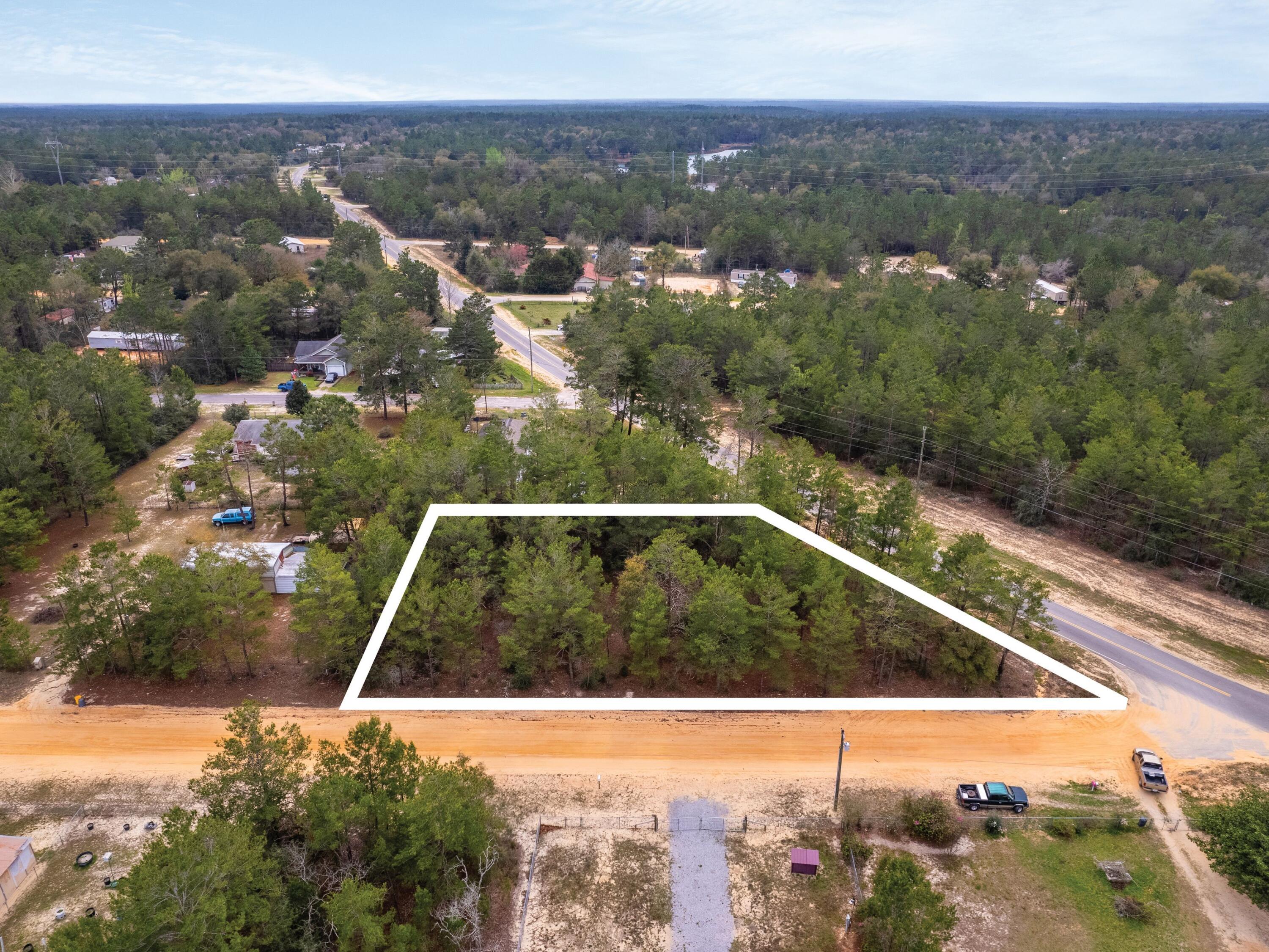 1-2 Girl Scout Road DeFuniak Springs, FL 32433 - Photo 4 of 13 a view of a yard with a small yard