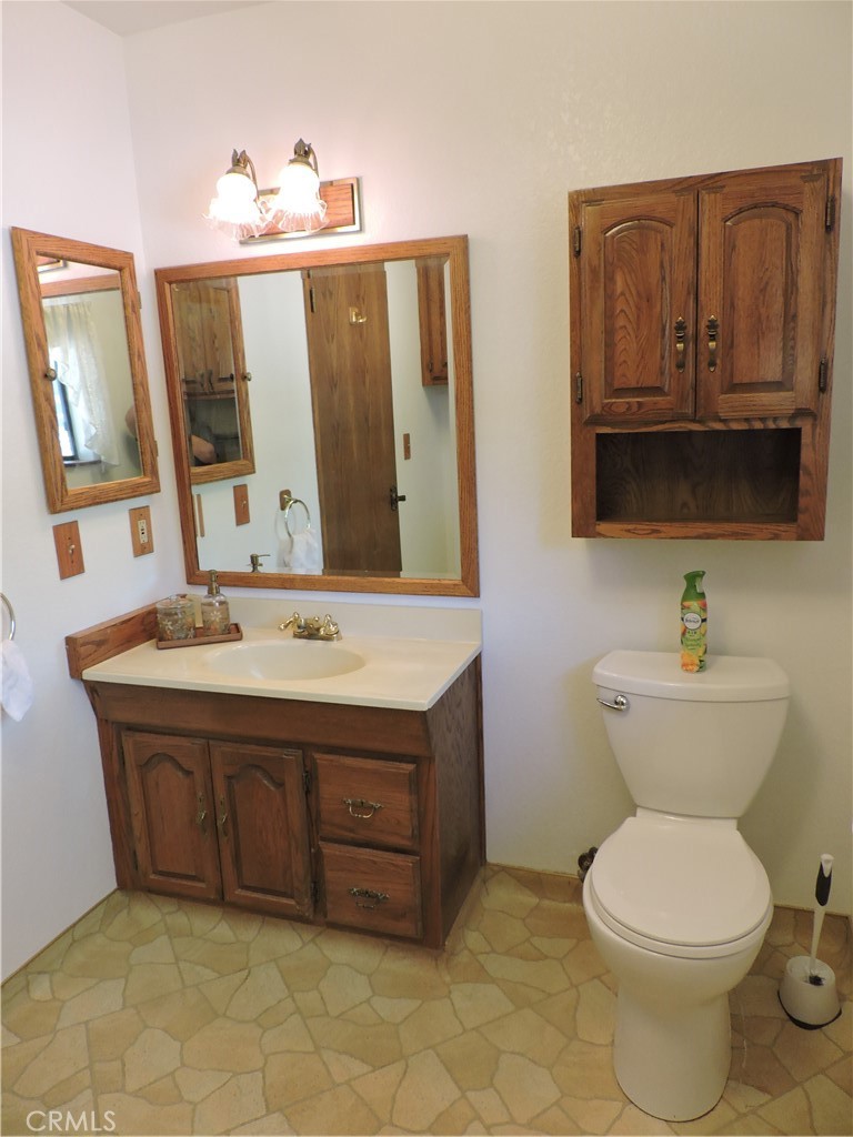 26931 Columbia Way Tehachapi, CA 93561 - Photo 37 of 49 Half Bath located off of kitchen and close to garage.