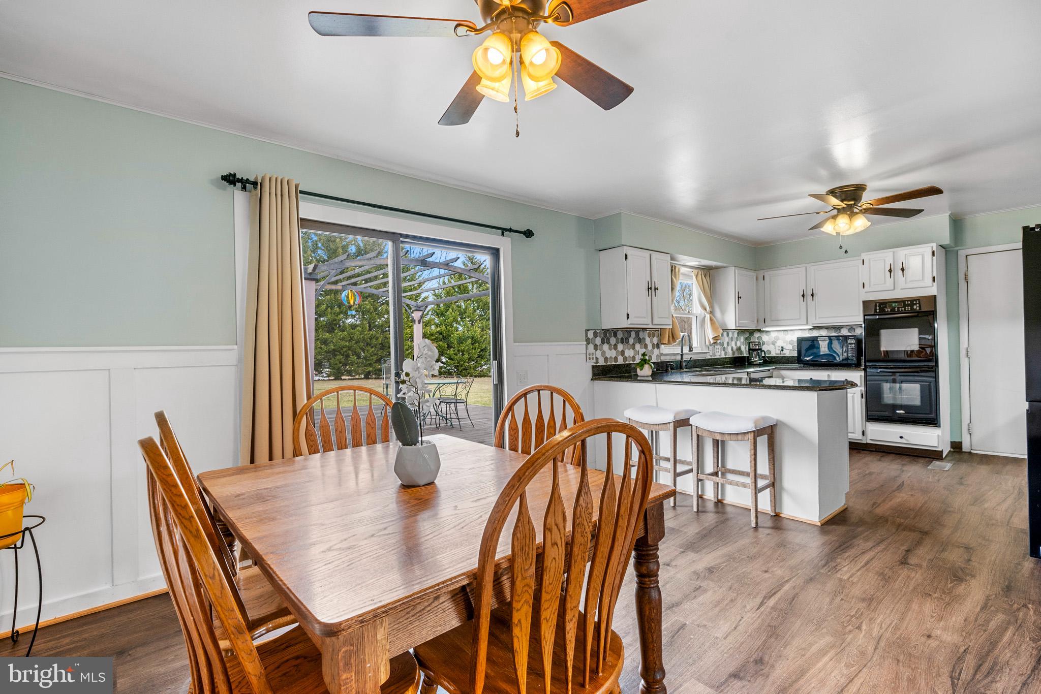 7600 Simms Landing Road Port Tobacco, MD 20677 - Photo 11 of 40 Table space with doors to deck