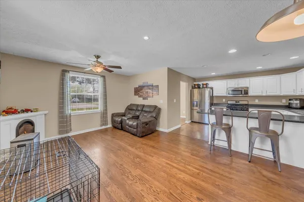 a living room with furniture and a table