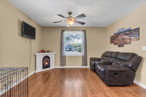 a living room with furniture and a fireplace