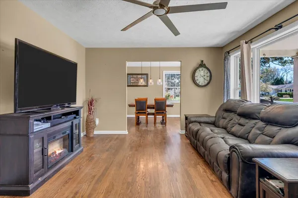 a living room with furniture and a flat screen tv