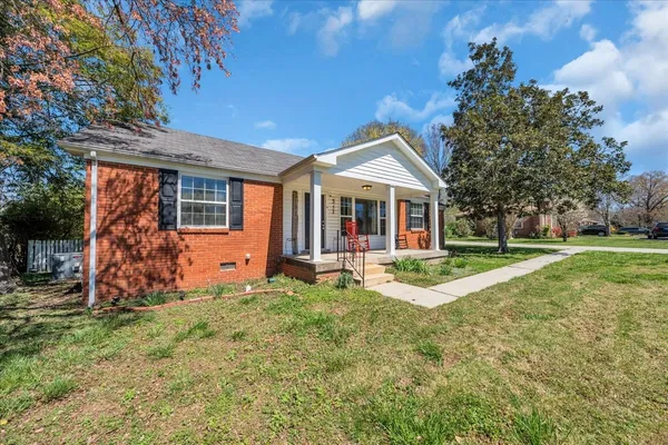 front view of a house with a yard