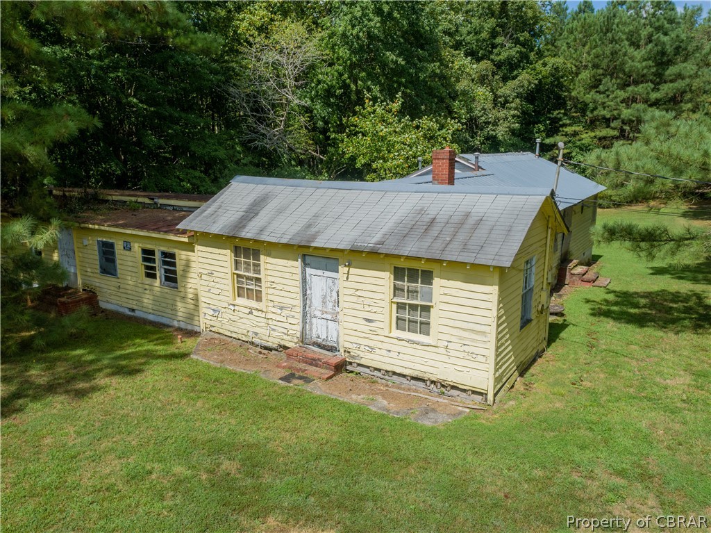 1220 Weems Road Weems, VA 22576 - Photo 1 of 12 a view of a house with a yard