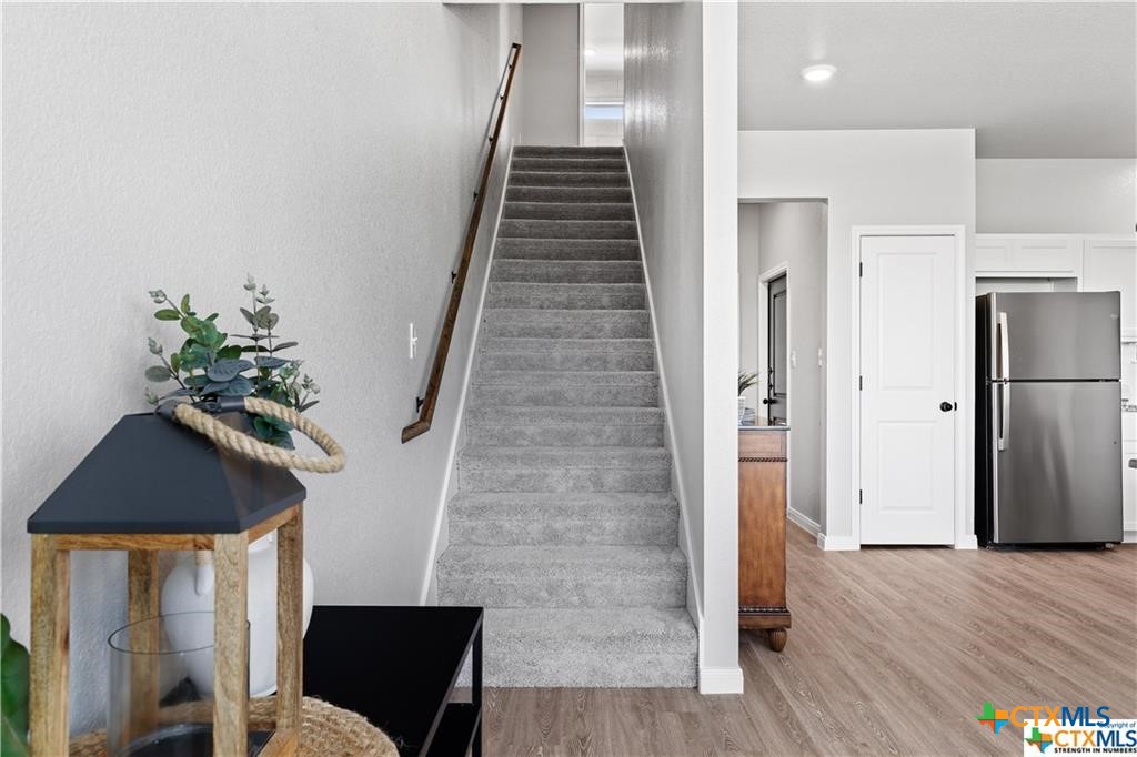 746 Meiomi Drive Temple, TX 76502 - Photo 13 of 32 a view of entryway with wooden floor and stairs